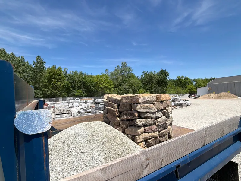 Autana dump truck loaded with stone and gravel for a hardscape job