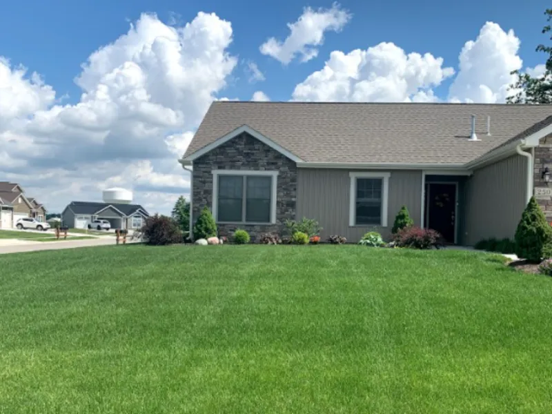 Manicured lawn with clean edging in front of a ranch home